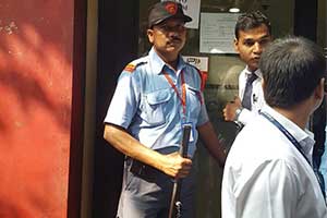 security guard of pvs security service, outside an ATM counter 1
